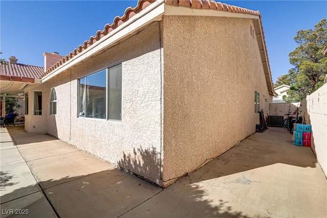 view of home's exterior featuring a patio