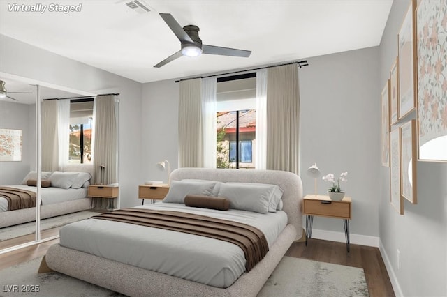 bedroom with ceiling fan and hardwood / wood-style floors