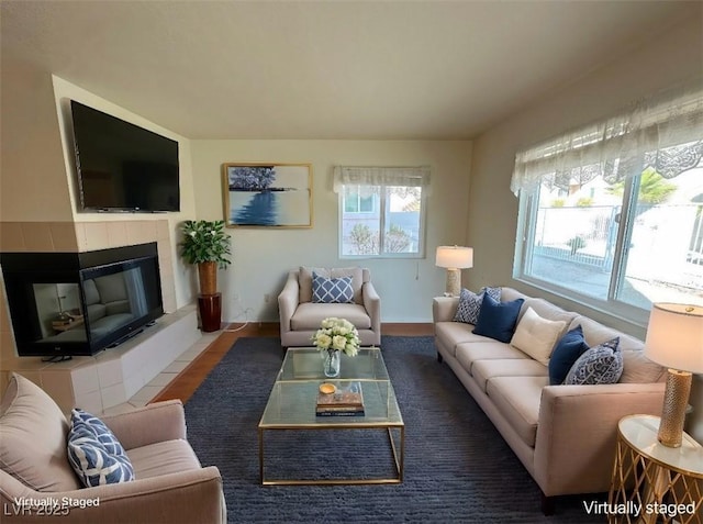 living room featuring a fireplace