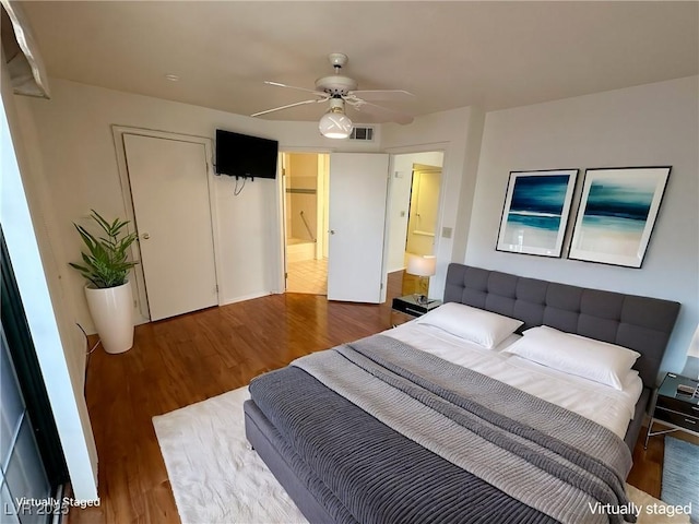 bedroom featuring hardwood / wood-style floors and ceiling fan