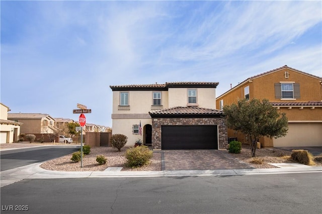 mediterranean / spanish-style house with a garage