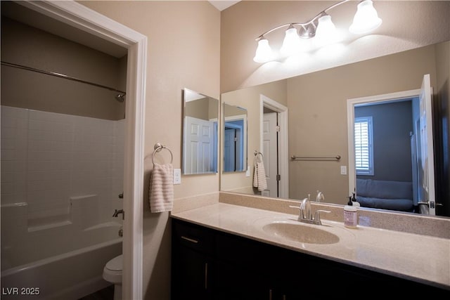 full bathroom with vanity, bathtub / shower combination, and toilet