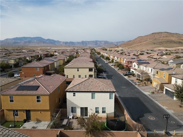 birds eye view of property featuring a mountain view