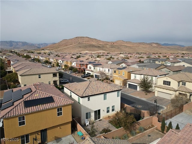 birds eye view of property with a mountain view