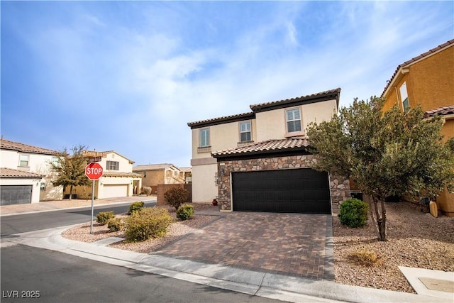 mediterranean / spanish house featuring a garage