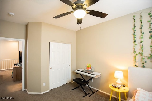 unfurnished office featuring ceiling fan and dark carpet