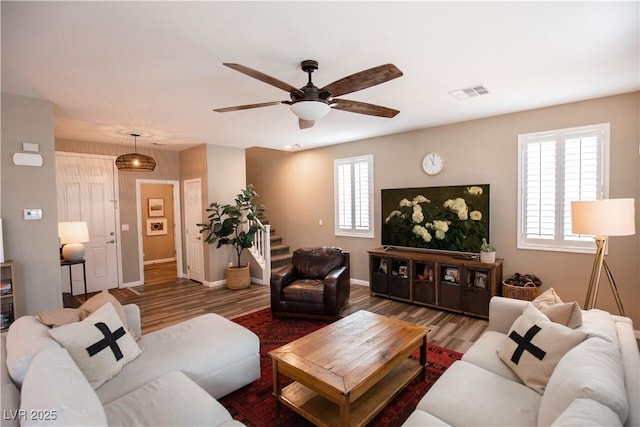 living room with ceiling fan and wood-type flooring