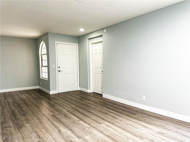 entrance foyer featuring hardwood / wood-style flooring