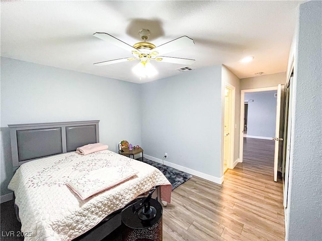 bedroom featuring ceiling fan and light wood-type flooring