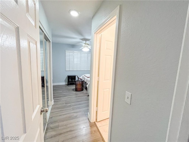 hallway featuring light wood-type flooring