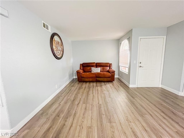 sitting room with light wood-type flooring