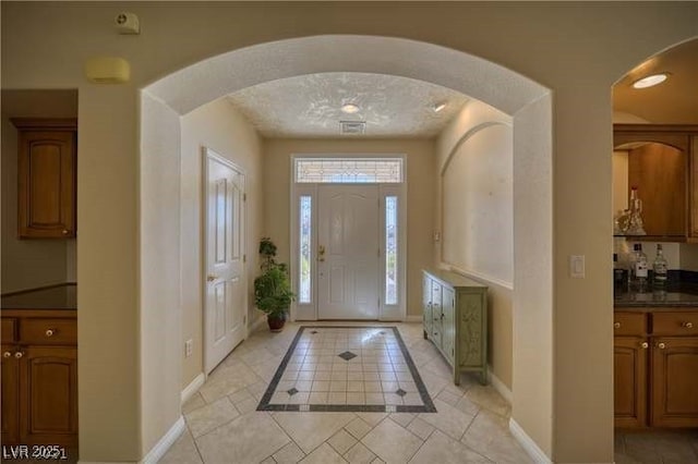 view of tiled foyer entrance