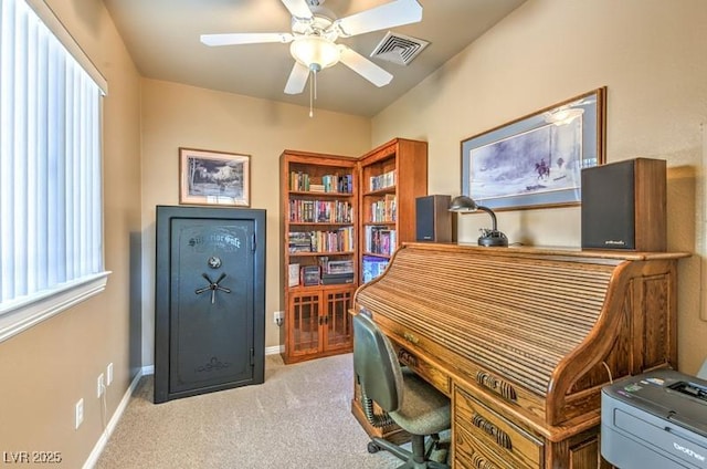 carpeted office featuring ceiling fan