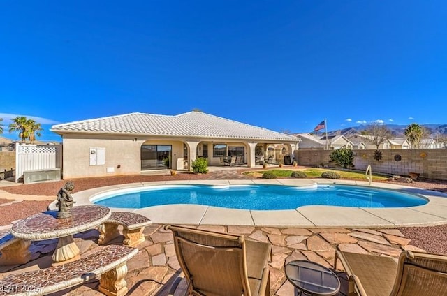 view of swimming pool with a patio