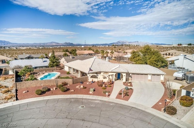 birds eye view of property with a mountain view