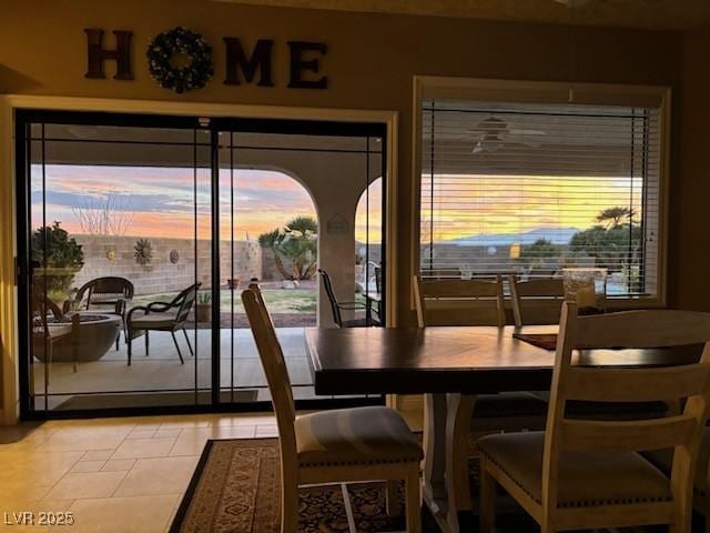 dining area featuring light tile patterned floors