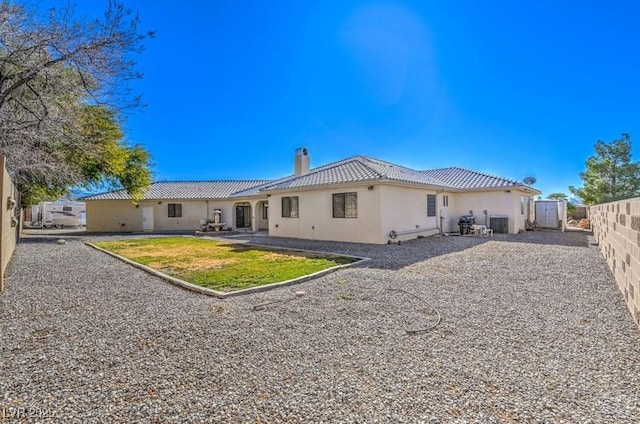 rear view of house with a lawn