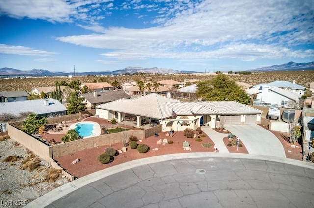 birds eye view of property featuring a mountain view