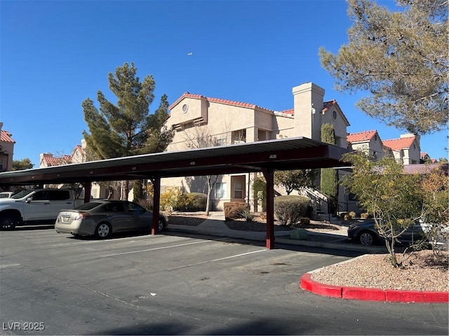 view of partially covered parking lot