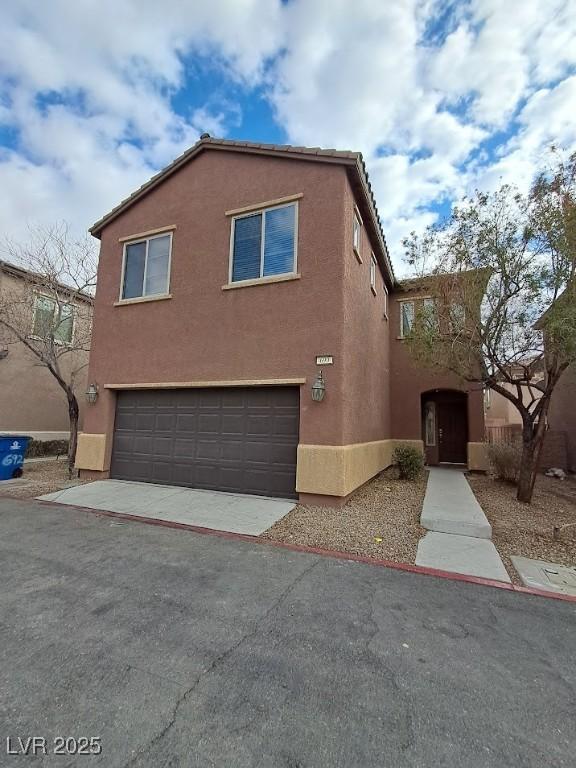 view of side of property with a garage