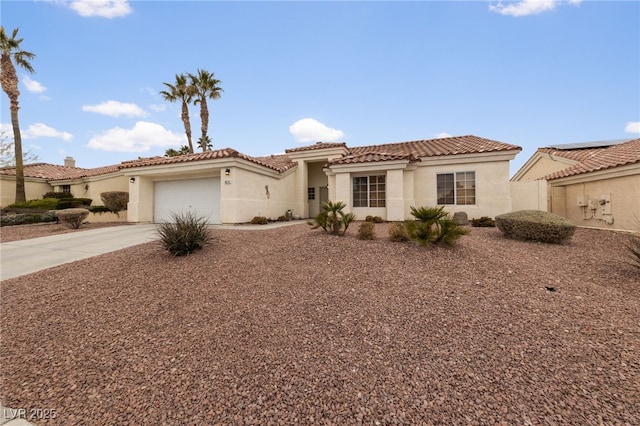 mediterranean / spanish-style home with a garage