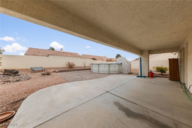 view of patio featuring a fenced in pool