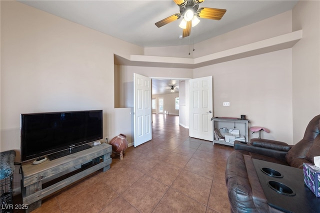 living room with tile patterned floors and ceiling fan