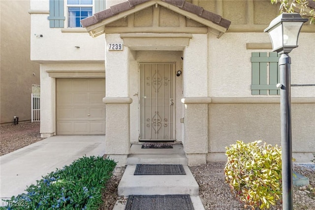 doorway to property featuring a garage