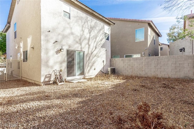 rear view of house with central air condition unit