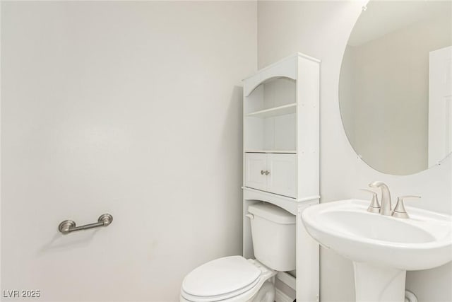 bathroom with sink and toilet