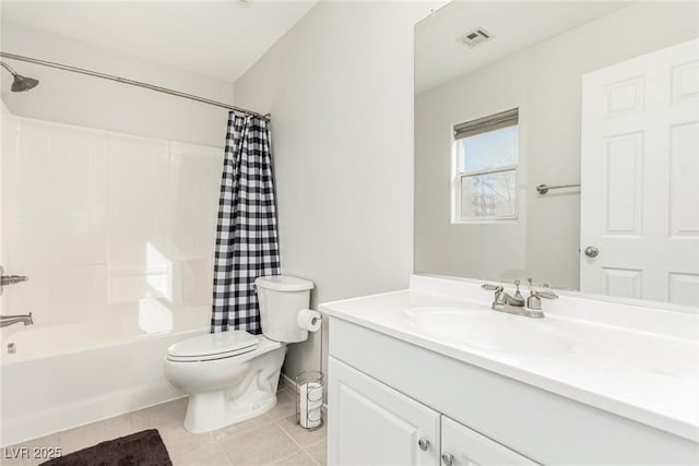 full bathroom featuring vanity, shower / bathtub combination with curtain, tile patterned floors, and toilet