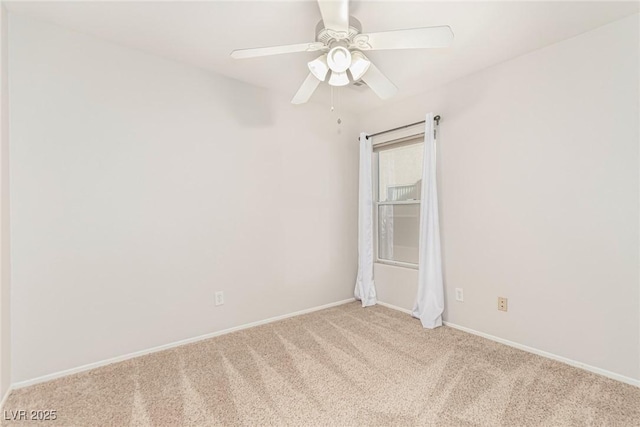 empty room with light colored carpet and ceiling fan