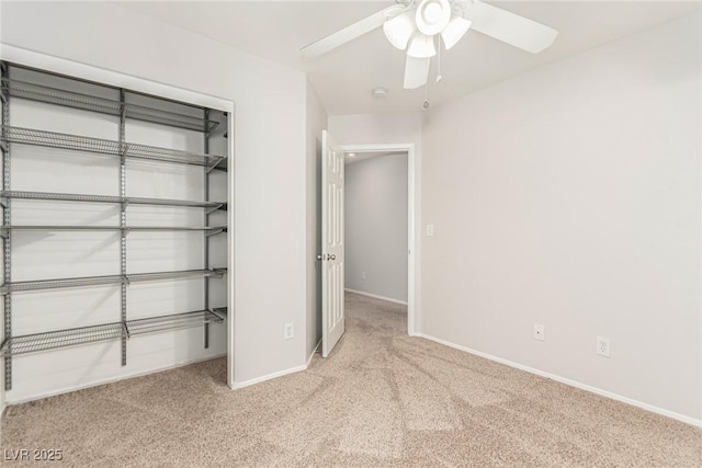 unfurnished bedroom featuring light colored carpet, a closet, and ceiling fan