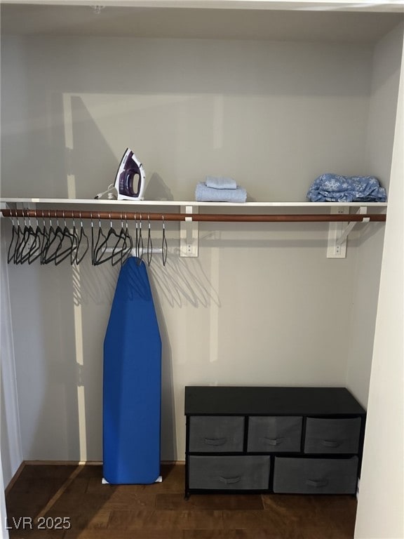 walk in closet featuring dark wood-type flooring