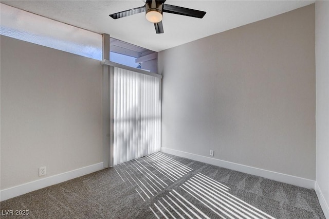 empty room with ceiling fan and carpet