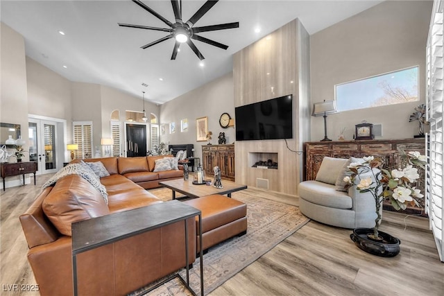 520 Summer Mesa Dr, Las Vegas, NV 89144 - living area with light wood finished floors, recessed lighting, ceiling fan, and high vaulted ceiling