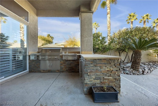 520 Summer Mesa Dr, Las Vegas, NV 89144 - view of patio featuring a grill, area for grilling, and a sink