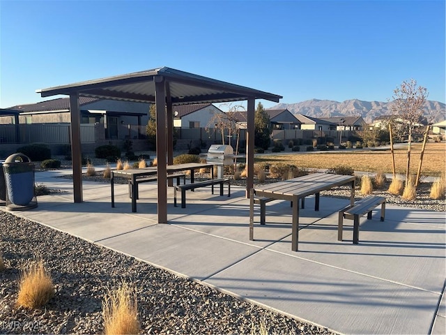 view of community with a mountain view and a gazebo