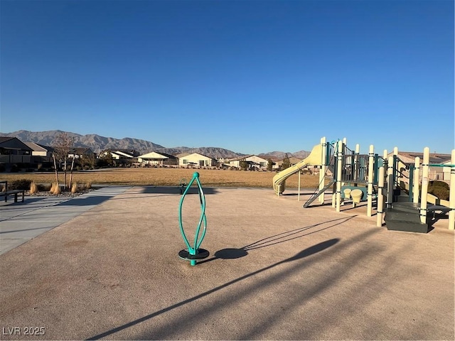 view of playground with a mountain view