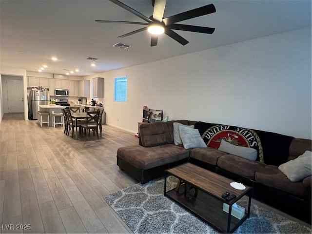 living room with light hardwood / wood-style floors