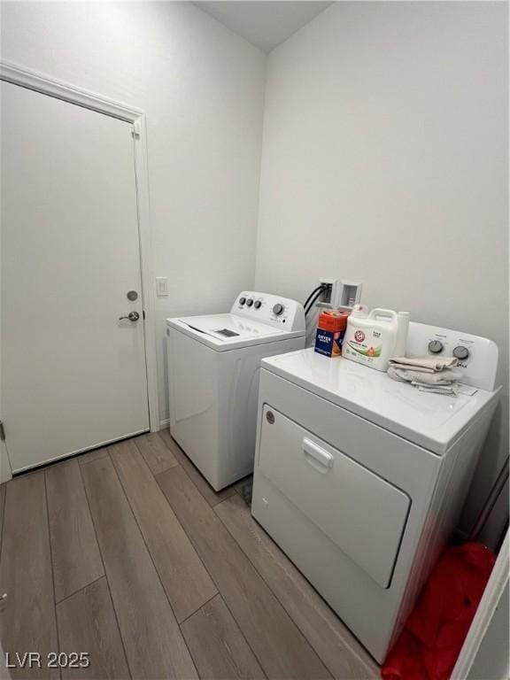 washroom with washing machine and clothes dryer