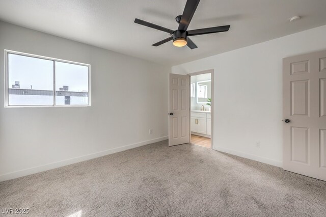 unfurnished room featuring ceiling fan and light carpet