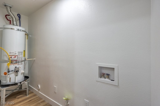 utility room featuring secured water heater