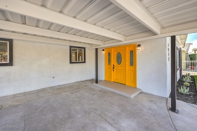 property entrance featuring covered porch