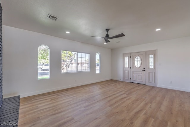 entrance foyer with light wood finished floors, visible vents, recessed lighting, and baseboards