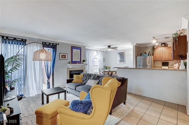 tiled living room with crown molding and ceiling fan