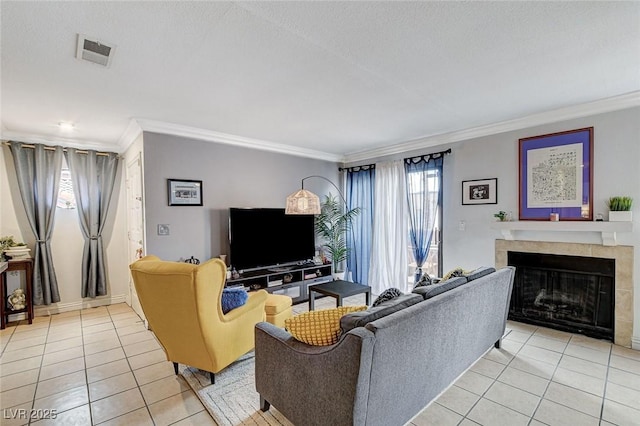 tiled living room featuring ornamental molding, plenty of natural light, and a textured ceiling