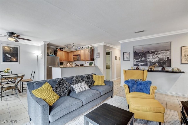 tiled living room featuring ornamental molding and ceiling fan