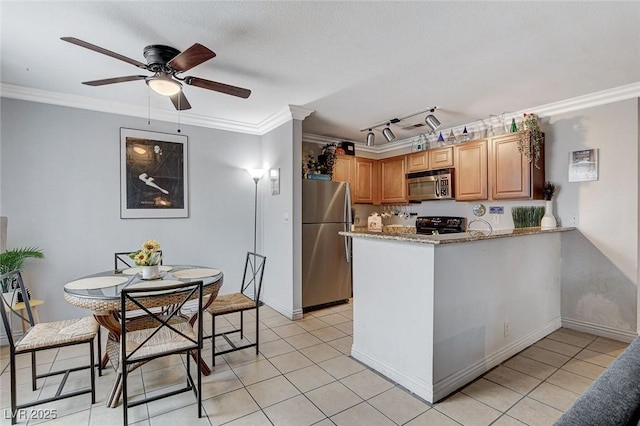 kitchen with light tile patterned floors, crown molding, stainless steel appliances, light stone countertops, and kitchen peninsula