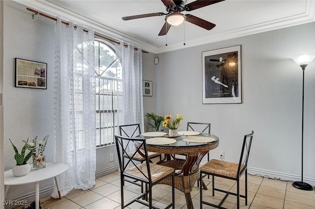 dining room featuring light tile patterned floors, crown molding, and ceiling fan